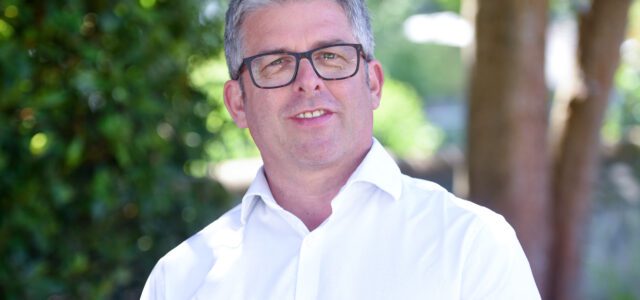 Simon Rogers standing outside